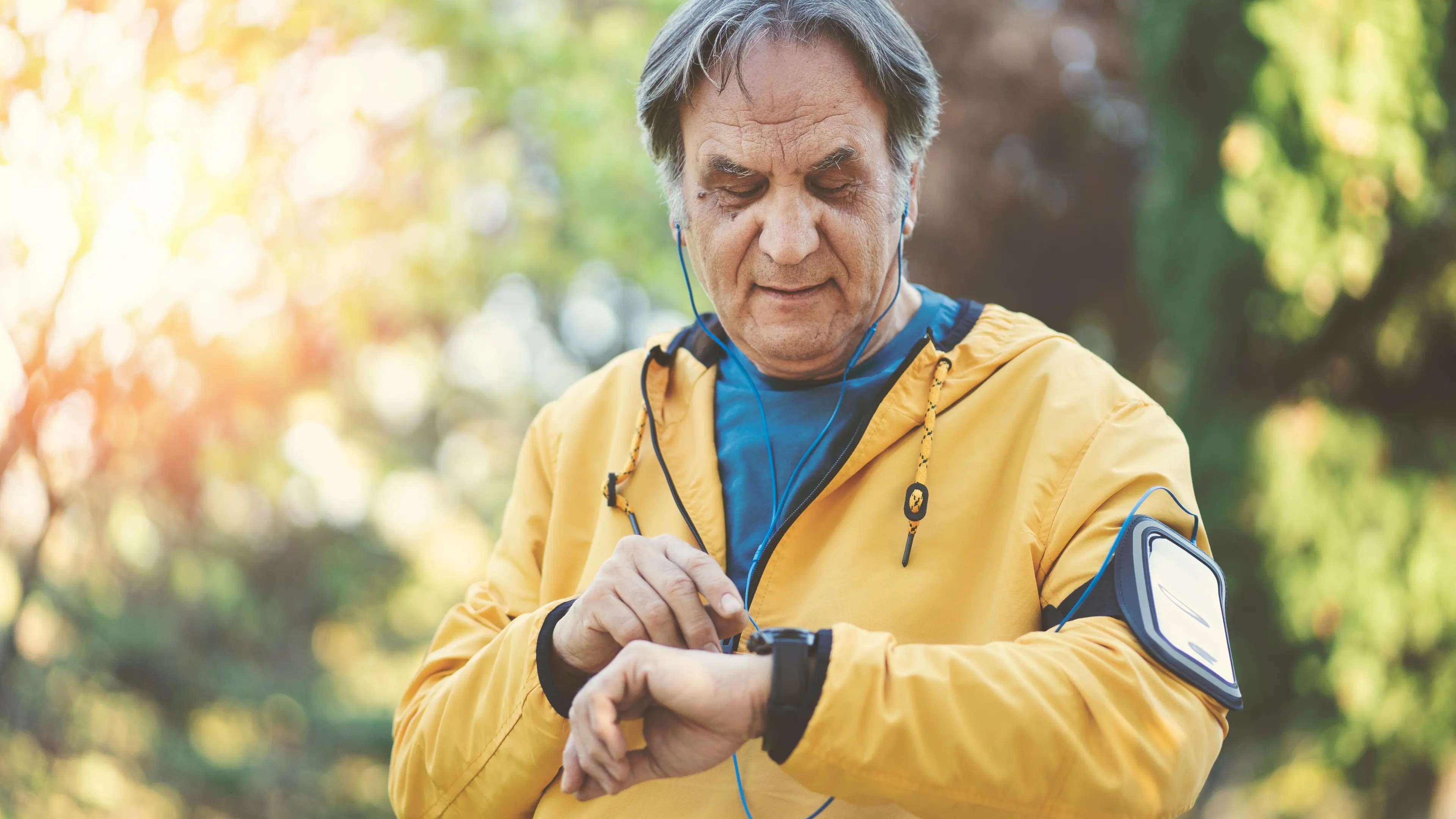 an old man checks his watch
