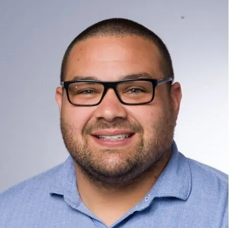 Man with glasses smiling