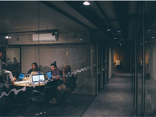 A group of people working in a meeting room